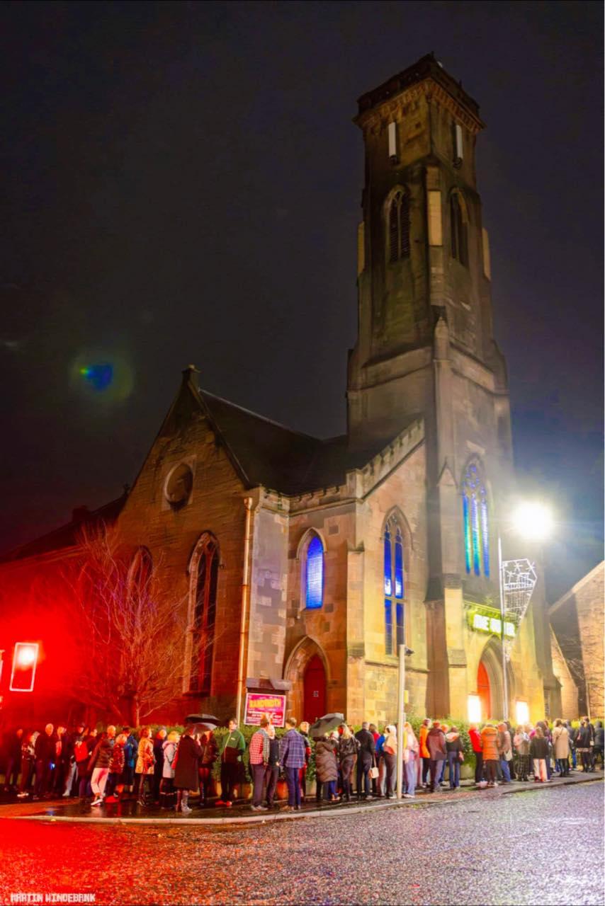 A queue along Sinclair Street outside The Tower on a winter night